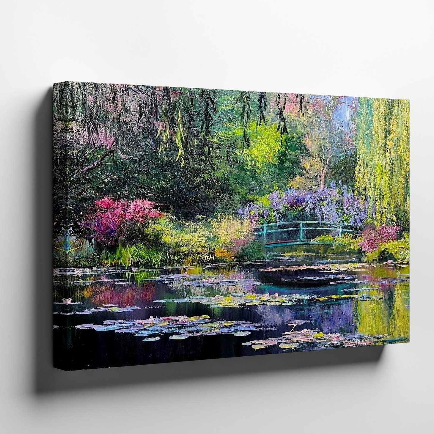 Serene garden pond with vibrant flowers and green bridge canvas wall art print
