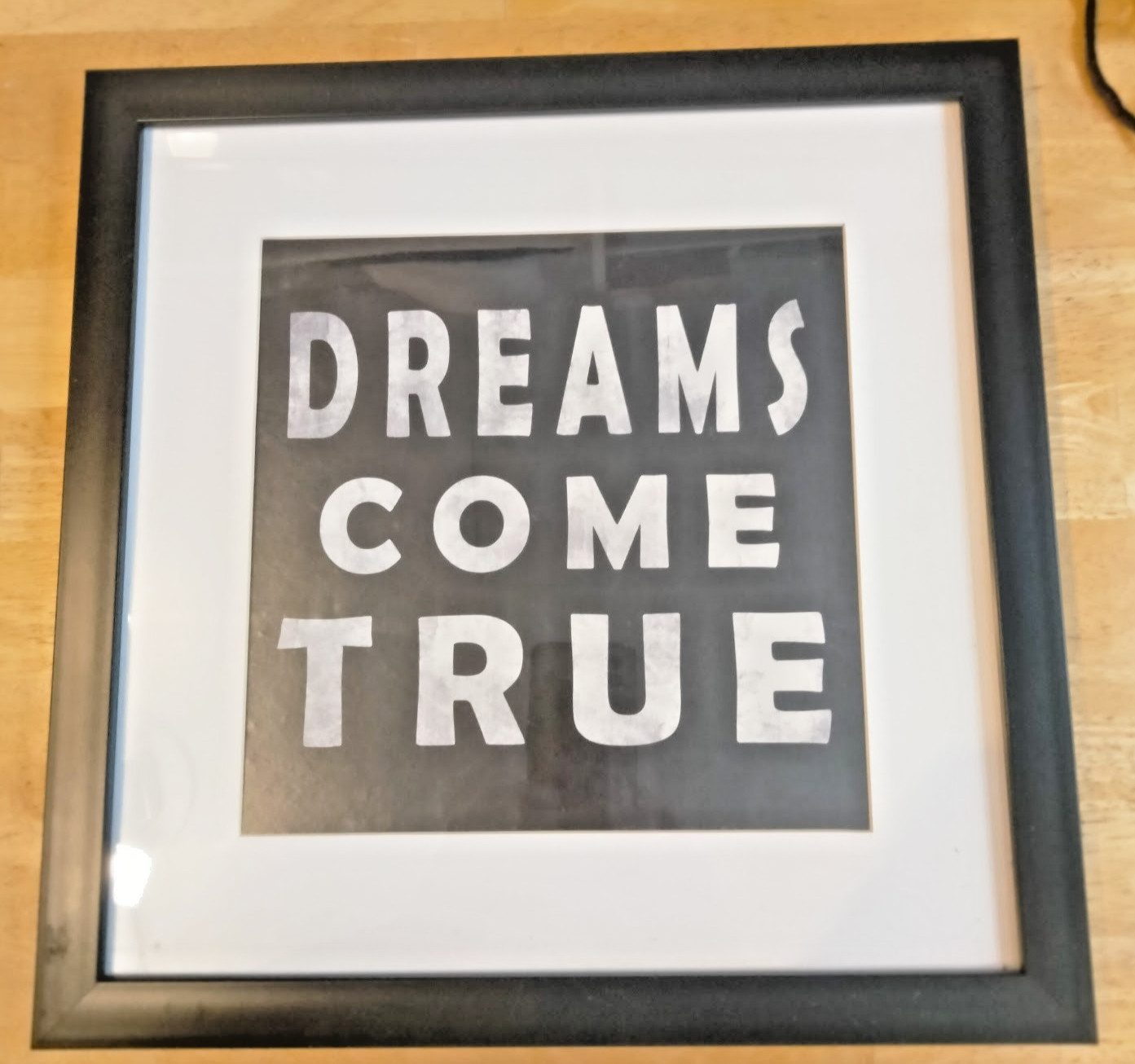 «DREAMS COME TRUE» black & white framed graphic artwork, 14″x14″ square.